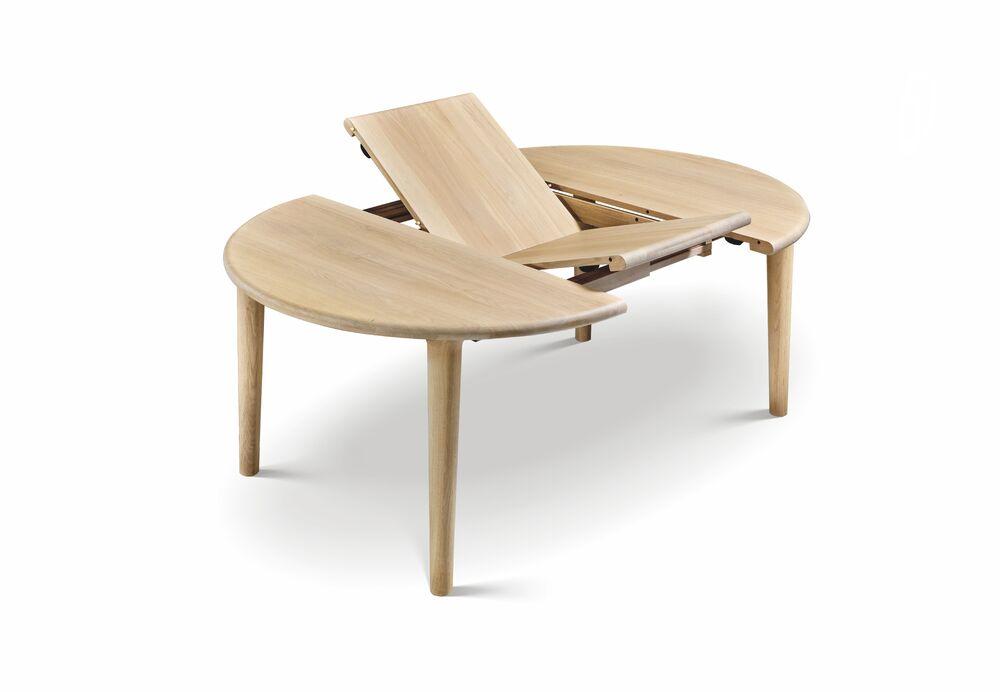 Elégante table ronde transformable en table ovale  2